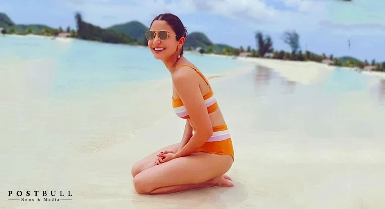 Anushka Sharma painted a happy picture, as she poses in yellow swimwear. See Pic